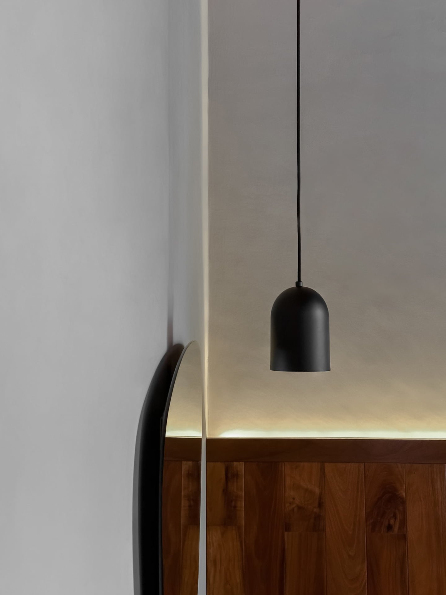 Black indoor wall hanging lamp designed in Mexico