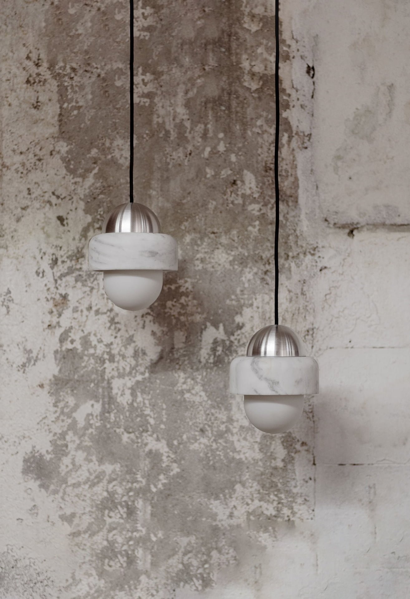 White marble and aluminum ceiling lamps designed by Distrito Bandido