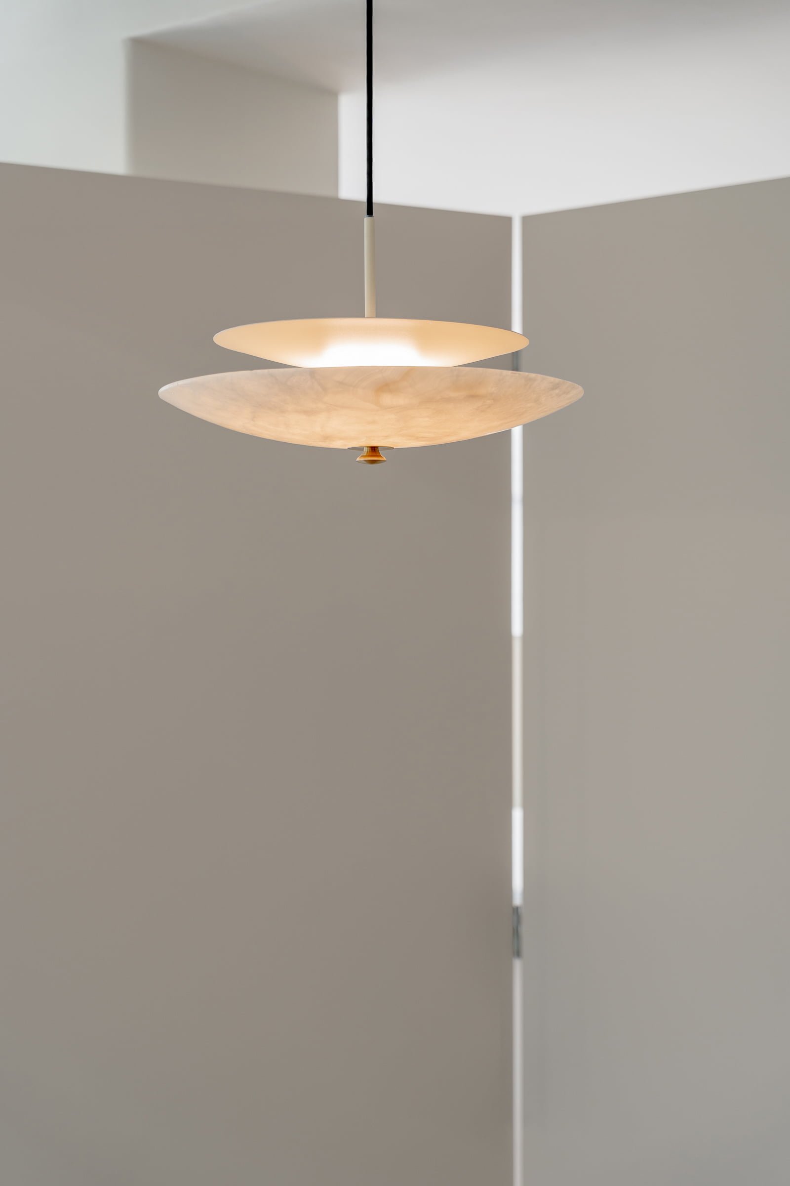 Stone pendant lamp designed by Distrito Bandido