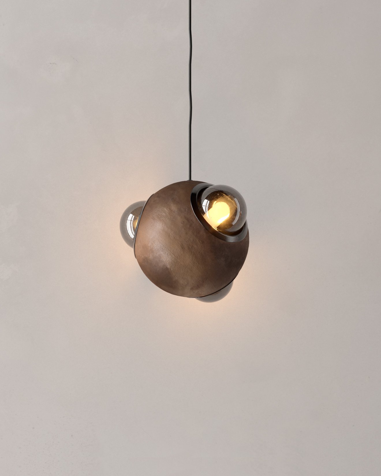 HUMO 18 hanging lamp in mottled mud color with smoked glass diffusers and black anodized aluminum detail designed by Bandido Studio