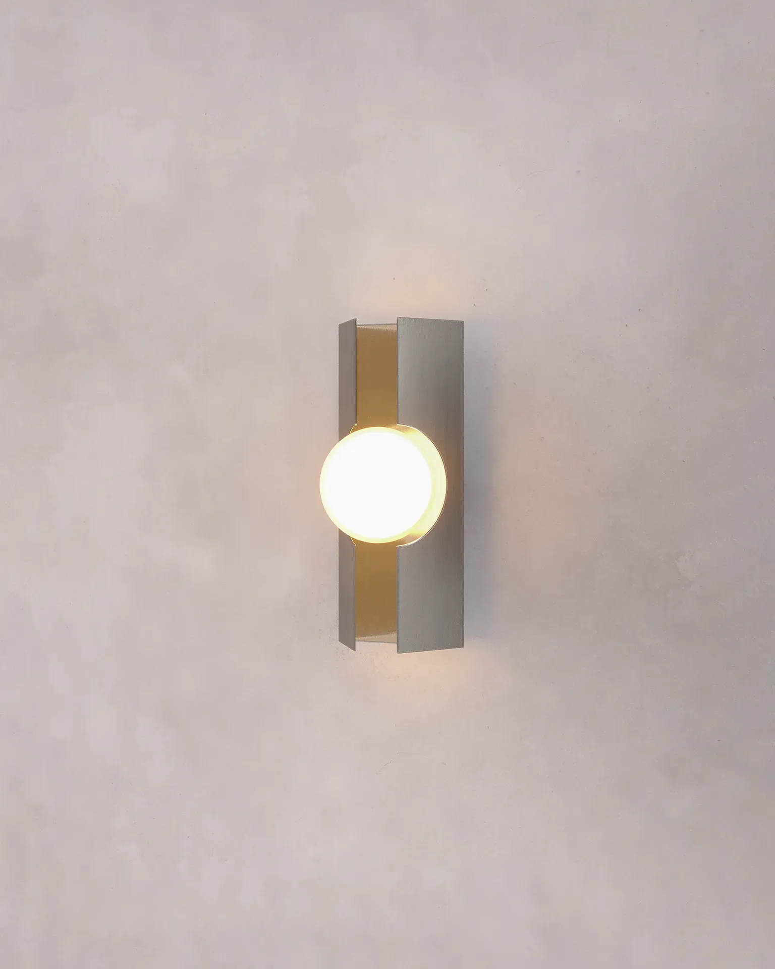 NOVA Chapter | FLUX lamp with a stainless steel sconce and glass diffuser designed by Bandido Studio
