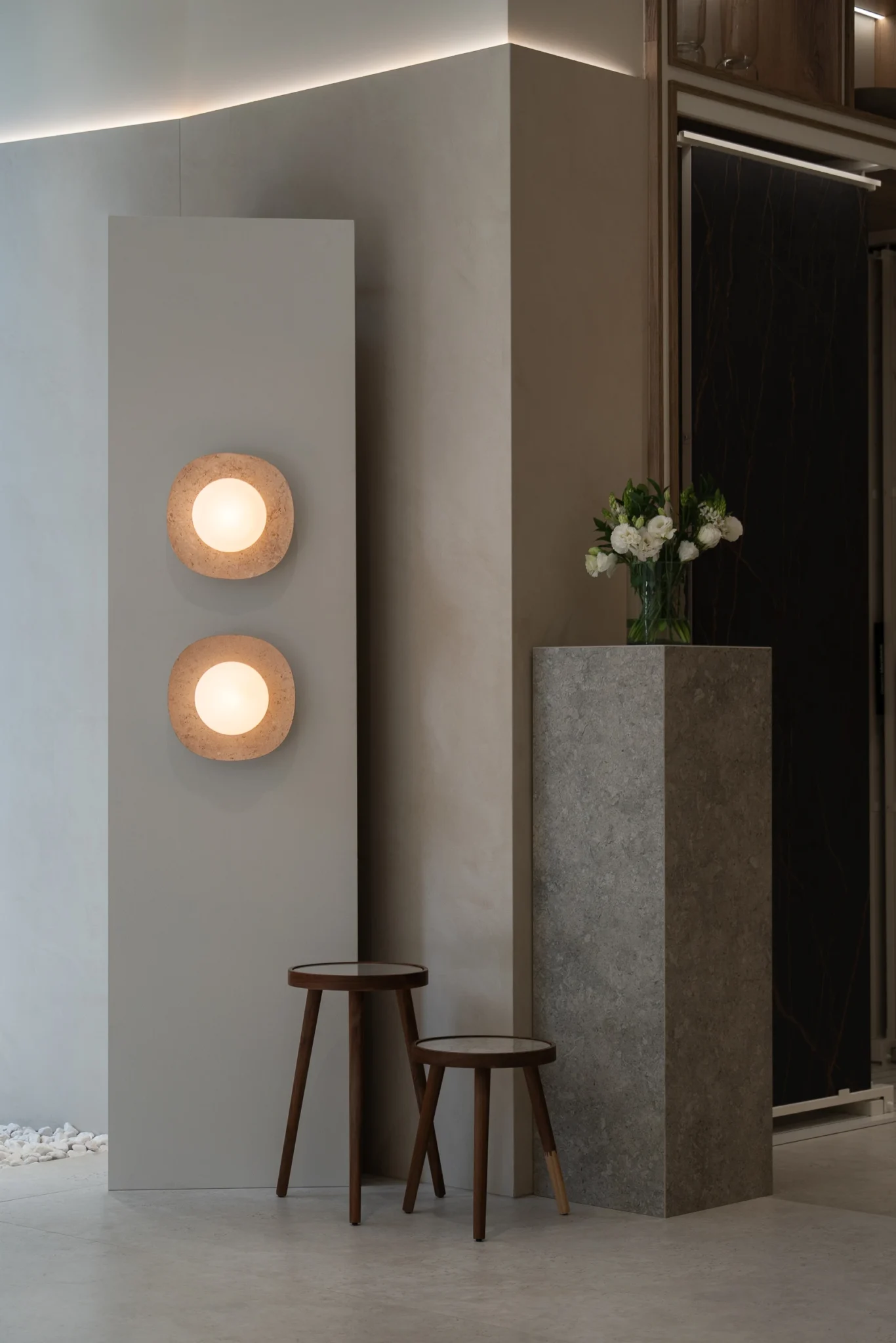 NAGA travertine marble wall lamps designed by Bandido at Cosentino City CDMX Materia&Luz 2025